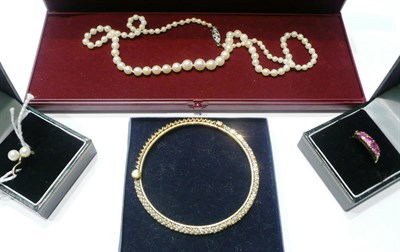 Lot 61 - A cultured pearl necklace, a seed pearl bangle (a.f.), a ruby five stone ring and a cultured...