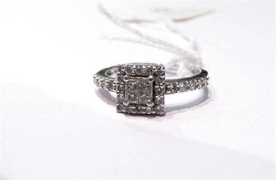 Lot 67 - A multi diamond cluster ring, stamped 'PT 950'