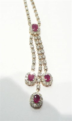 Lot 77 - A ruby and diamond necklace with three pendant drops