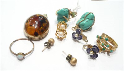 Lot 80 - A turquoise matrix pendant and ring, an amber pendant, a turquoise-set five band ring, an opal...