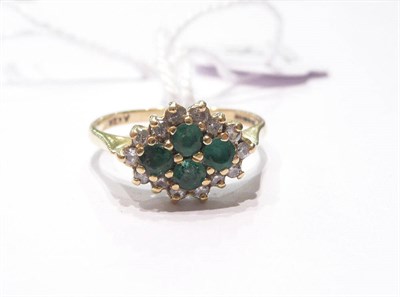 Lot 84 - An emerald and diamond cluster ring