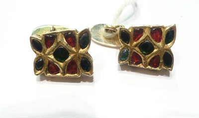 Lot 88 - A pair of cufflinks, in the Kundan style, each panel with red and green foil backed stones...