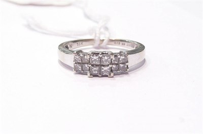 Lot 94 - A princess cut diamond triple cluster ring
