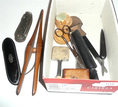 Lot 104 - Collectables including glove-stretchers, two quill cutters, a seam rubber, miniature mirror,...