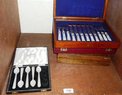 Lot 118 - A set of dessert knives and forks, fish knives and forks, five mother of pearl spoons and a set...