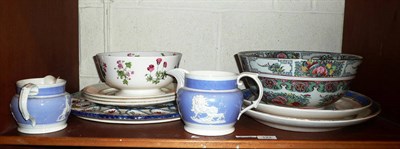 Lot 123 - A shelf including two 19th pottery jugs with relief decoration, a Mintons bowl and other decorative