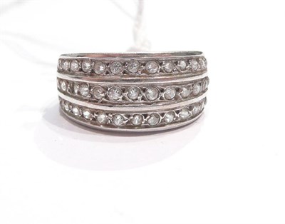 Lot 149 - A diamond three row ring (one stone missing)