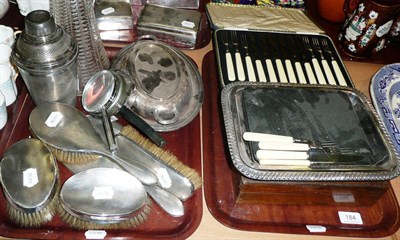 Lot 184 - Four silver-backed brushes, a similar hand-held mirror, a claret jug with plated mounts and a...