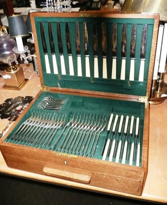 Lot 201 - A canteen of plated flatware in an oak case