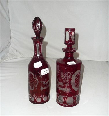 Lot 214 - Red overlay glass decanter and stopper etched with stags and another similar (2)