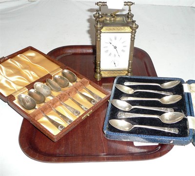 Lot 234 - Gilt carriage clock and two sets of silver spoons