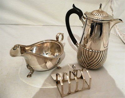 Lot 238 - Silver hot water jug, sauce boat and a toast rack