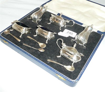 Lot 240 - A silver cased condiment set