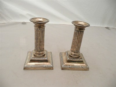 Lot 254 - Pair of silver candlesticks