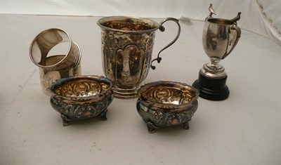 Lot 257 - Small silver mug, napkin rings, pair of salts and a small trophy