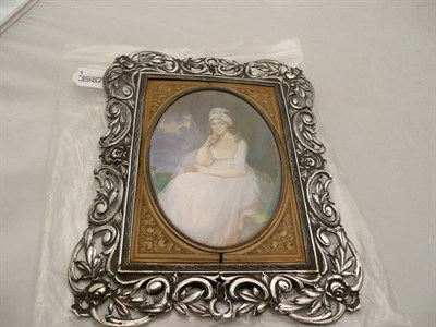 Lot 261 - W Petrie - miniature of a lady seated by a lake, French 19th century in a white metal scroll frame