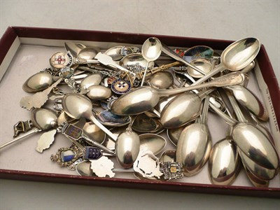 Lot 265 - Two sets of six silver teaspoons and forty three silver and white metal souvenir spoons