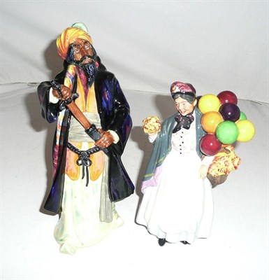 Lot 290 - Two Royal Doulton ceramic figures 'Biddy Pennyfarthing' HN1843 and 'Blue Beard' HN2105