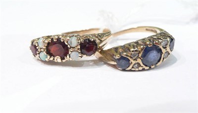 Lot 307 - Diamond and sapphire ring and a red stone and opal ring