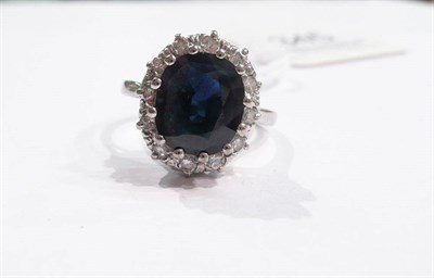 Lot 345 - A sapphire and diamond cluster ring