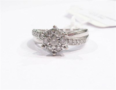 Lot 350 - A diamond cluster ring with diamond set shoulders