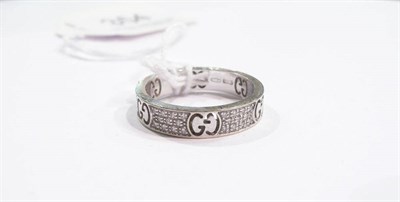 Lot 354 - An 18ct white gold diamond set band ring, by Gucci