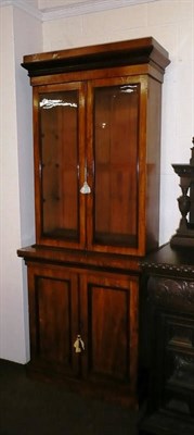 Lot 404 - A glazed walnut bookcase