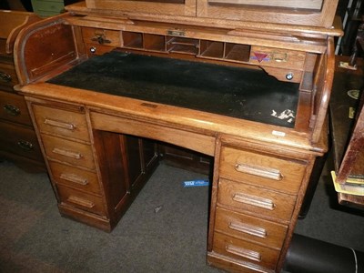 Lot 419 - An oak tambour desk