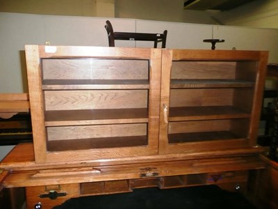 Lot 421 - A reproduction oak plate rack, similar glazed pine display cabinet, and a small wall shelf (3)