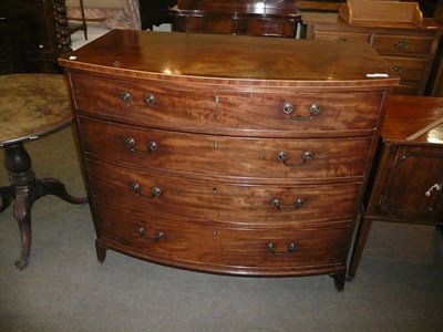 Lot 424 - A Georgian cross-banded mahogany bow fronted four height chest of drawers