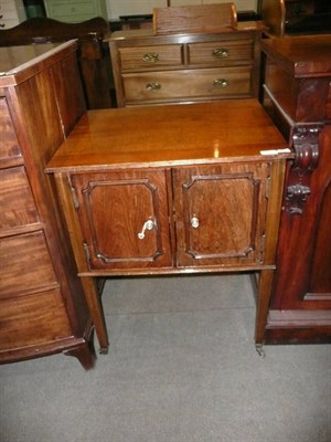 Lot 425 - An Edwardian mahogany music cabinet