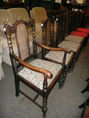 Lot 442 - Four 1920's oak and cane backed dining chairs, including one carver