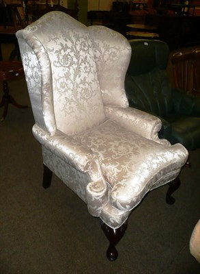 Lot 456 - An upholstered Bridgecraft wingback armchair