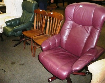 Lot 457 - Two modern leather armchairs, two footstools and two pine chairs