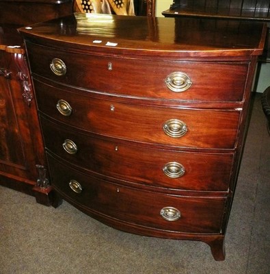 Lot 482 - George III bow fronted four drawer chest