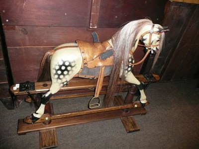 Lot 485 - Dapple grey rocking horse on treadle stand possibly by F H Ayres