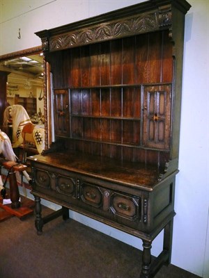 Lot 487 - Carved oak dresser and rack