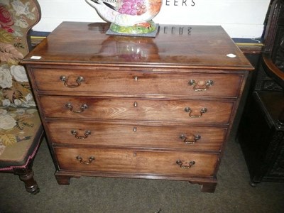 Lot 494 - George III mahogany cross-banded four drawer chest