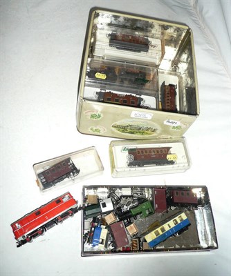 Lot 1068 - A Collection of 'HOe' or 'N' Gauge Trains, boxed and unboxed, mainly Liliput, also Atlas and...