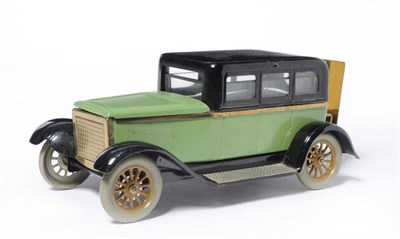 Lot 1126 - A German Tinplate Saloon Car Smokers Compendium, the purpose built car lithographed in green...