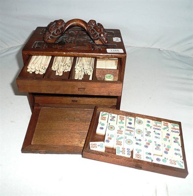 Lot 1165 - A Mah Jong Set, with bone and bamboo playing pieces, housed in a wooden five drawer chest...