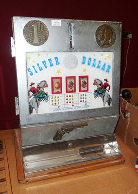 Lot 1178 - A 'Silver Dollar' One-Armed Bandit by Sty-Rin, with wooden body, chrome framed fascia inset...