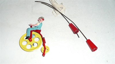 Lot 1184 - An English Cast Metal Clown on Penny Farthing Acrobat Toy by Slikka Toys (later Lone Star),...