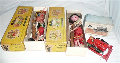 Lot 1188 - Two Boxed Pelham Puppets - Pinocchio and Gypsy, in yellow card boxes; A Boxed Dinky Supertoys...