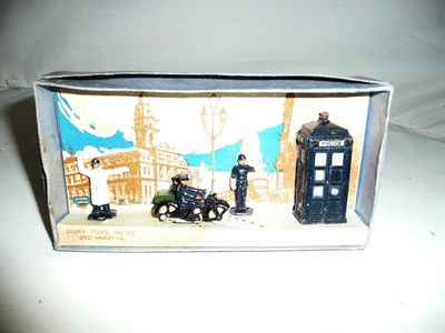 Lot 1248 - A Boxed Dinky Pre-War Police Gift Set No.42, containing police box, motor cycle patrol rider...