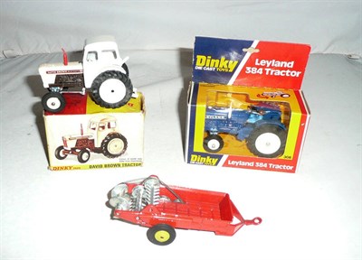 Lot 1250 - Two Boxed Dinky Tractors - Leyland 384 Tractor No.308, in blue with white exhaust and wheels,...