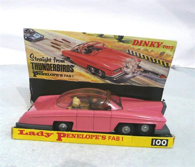 Lot 1255 - A Boxed Dinky Lady Penelope's Fab 1 No.100, in pink with pink striped sliding roof, two figures...