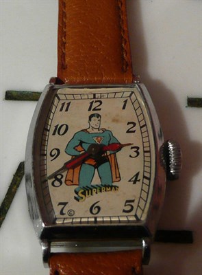 Lot 1273 - A Superman Wristwatch, with white metal tonneau shaped case and brown leather strap, working order