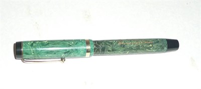 Lot 1289 - A National Security Fountain Pen, with green marbled body, button filler, single gilt metal...