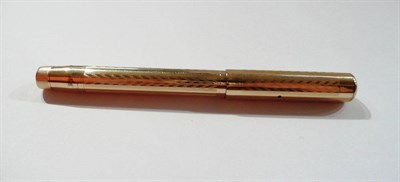 Lot 1290 - A Gold Plated Mabie Todd 'Swan' Fountain Pen, with engine turned decoration, leverless filler, 14ct